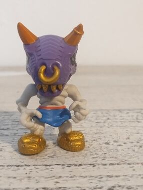 Moose Toys Treasure X Figure Dragon Dino Demon Purple Orange Horns Nose Ring
